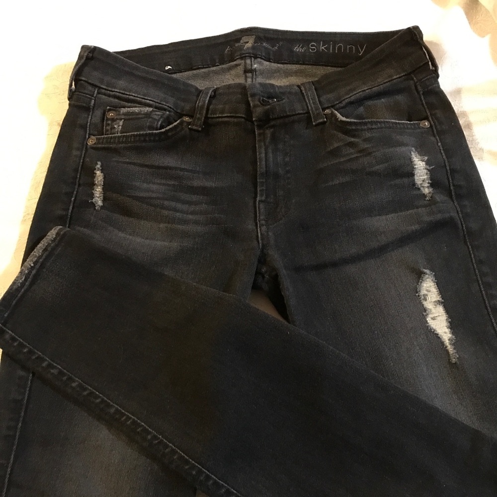 Distressed jeans.